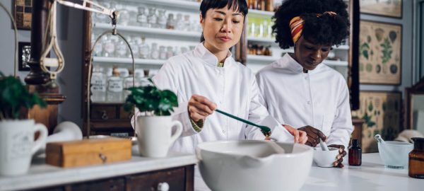 Apothecary workers are working on a drug and packing the tea in